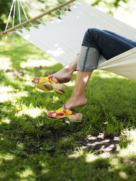 Woman resting in a hammock, Stockholm, Sweden.