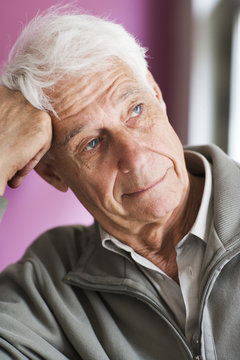 An old man with a thoughtful expression.