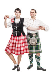 The pair woman and man dancing Scottish dance