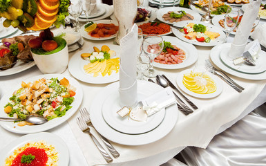 Fototapeta na wymiar Elegant tables set up for a wedding banquet