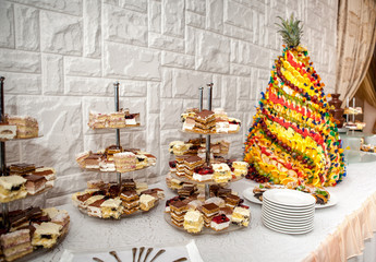 Dessert table with cake and candy on a wedding day