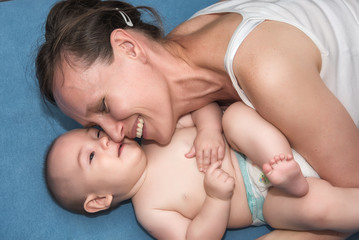 Portrait of happy mother and baby