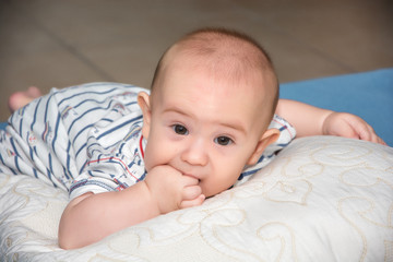 Portrait of a crawling baby in room