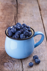 Ripe blueberries in a cup
