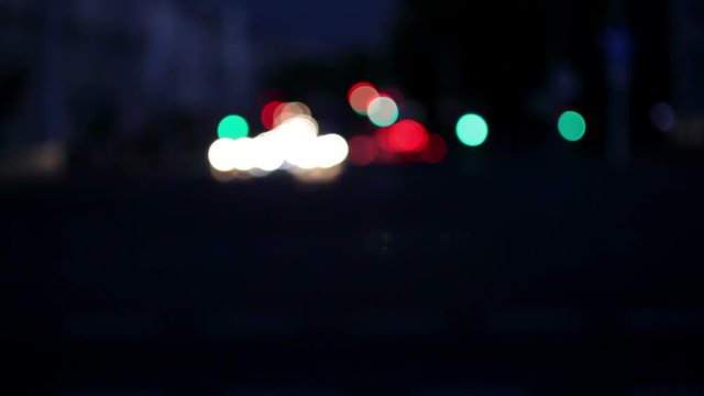Wandering lights. Blurred city traffic in the evening