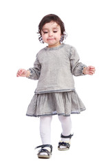 Portrait of little girl in grey clothes on a white background