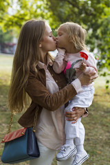 Fototapeta premium woman with child having fun in park
