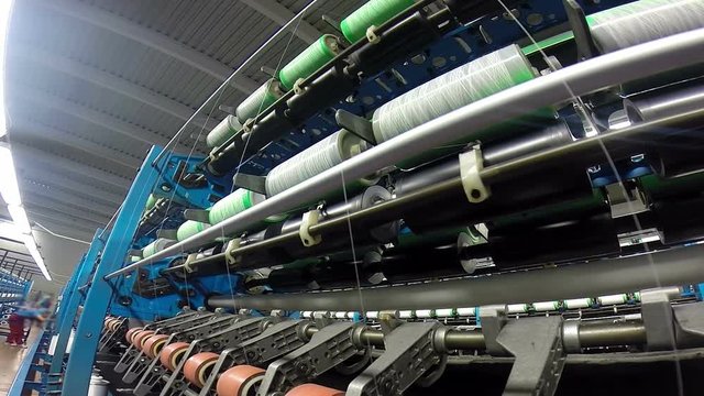 Winding the Yarn Onto Special Perforated Cones /Automated machines for yarn manufacturing in a textile factory. HD1080p. 