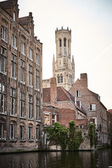 Boat trip on Canal in Bruges - Belgium / Facades and Belfry at Canal of Bruges in Belgium