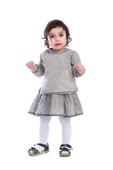 Portrait of little girl in grey clothes on a white background