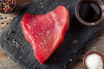 Fotobehang Raw Organic Pink Tuna Steak © Brent Hofacker