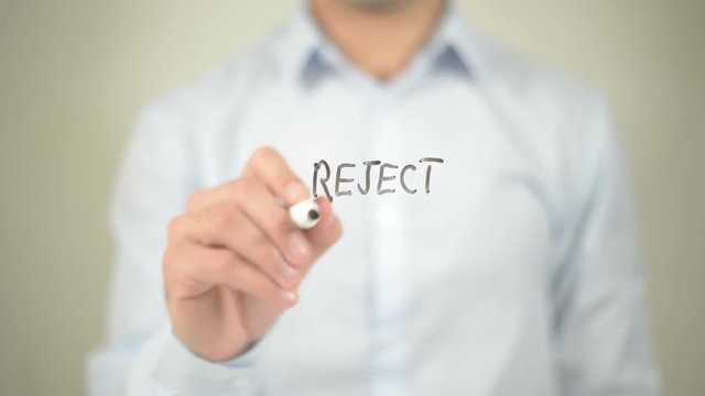 Reject Bigotry , man writing on transparent screen