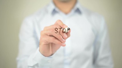 Stop Poverty , man writing on transparent screen