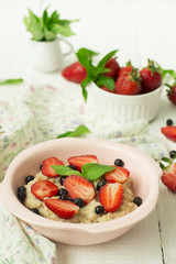 Porridge with berries - strawberries and blueberries