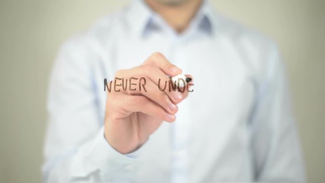 Never Undervalue Yourself , man writing on transparent screen