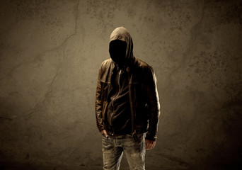 Obraz na płótnie Canvas Undercover hooded stranger in the dark