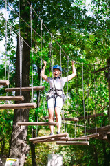 adventure climbing high wire park - people on course in mountain