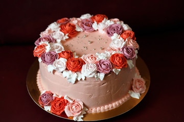 Birthday cake with red roses.