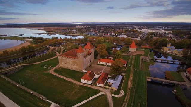 The beautiful green landscapes surrounding the castle of Kuressaare in Saaremaa. Seen also the aerial view of the whole city