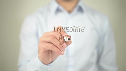 Immediate Action Required , man writing on transparent screen