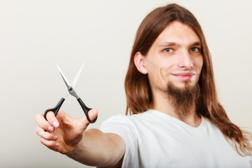 Hairstylist with scissors in hand