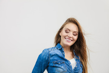 Obraz premium Joyful fashionable woman in denim shirt