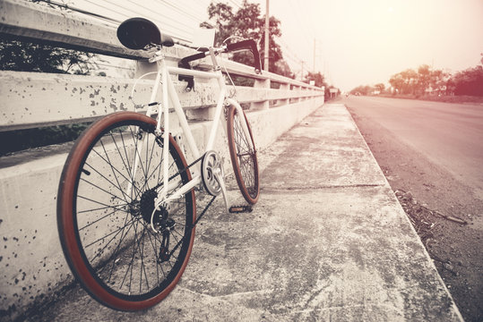 beautiful image with sport vintage bicycle at roadside ; vintage