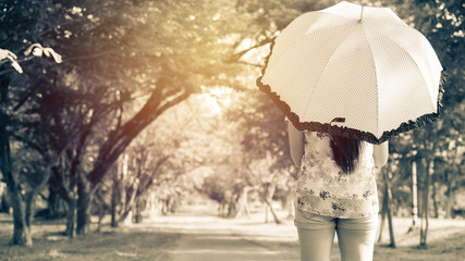 Portrait of Asian back woman holding umbrella ; vintage filter t