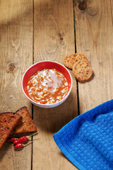 Goulash soup, sliced bread and towel