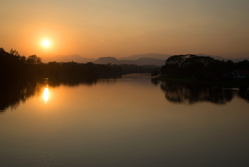 Naklejka premium Sunset on the river Kok in Chiang Rai surroundings. Northern Thailand