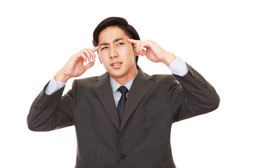 頭痛を訴えるビジネスマン