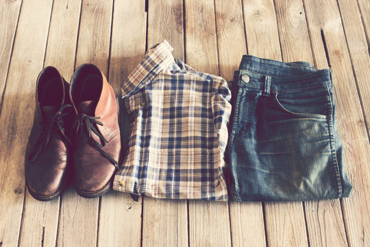 Vintage,Plaid shirt,Jean and leather shoes on wood background