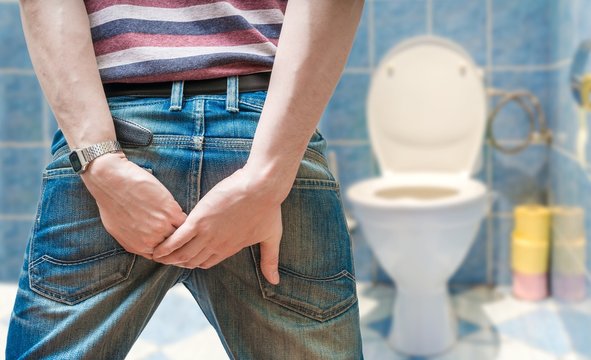 Man suffers from diarrhea in restroom.