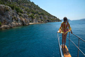 Fototapeta premium girl standing at the bow yacht