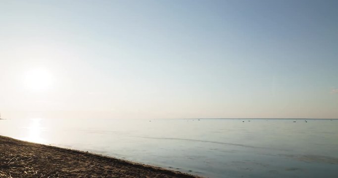 sunset timelapse over fin gulf baltic sea with small clouds and volumetric light, 4k prores footage