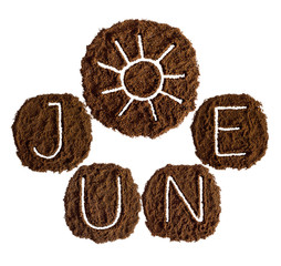 June and sun, decorated with ground coffee on white background