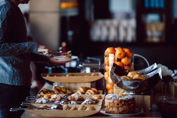 Assortment of fresh pastry on table in buffet