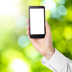 Hand shows mobile smart phone, nature blurred background