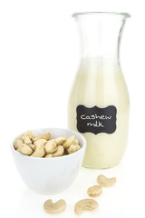 Cashew milk and cashews,  on white background