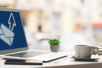 Modern technology with hot beverage on desk