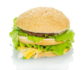 Big hamburger closeup isolated on white.