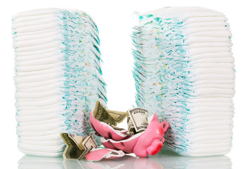 Stacks  children's disposable diapers, broken piggy bank, money isolated.