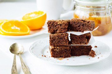 Pieces of chocolate brownie on white dish