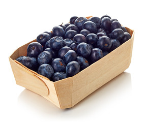 Blueberry in wooden box isolated on white