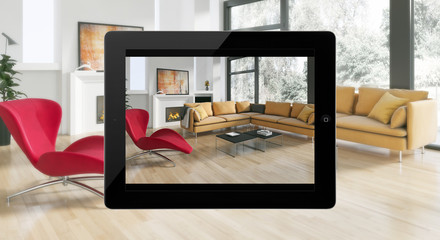 Soggiorno guardato con un tablet © 3DarcaStudio