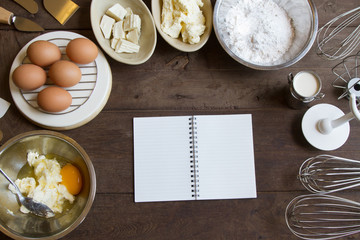 Bakery ingredient prepare on wooden table background, Top view copy space and notepad