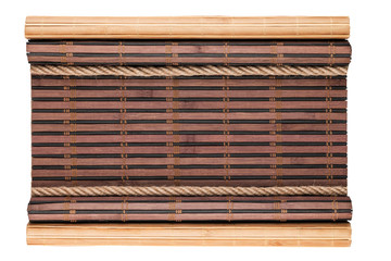 Bamboo mat with curled edges and rope, isolated
