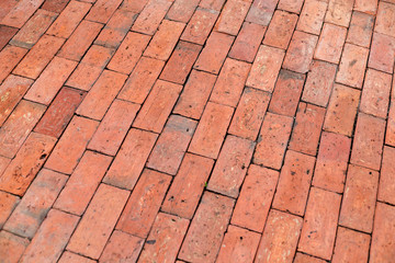 Red brick paving stones on a sidewalk