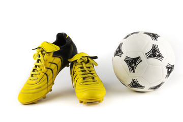 equipment for soccer player / over-white portrait of a pair of football shoes