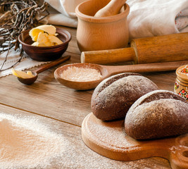 Freshly baked bread, flour and cooking utensils